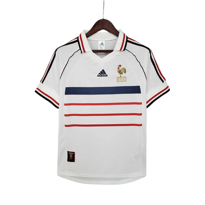 https://cdn.shopify.com/s/files/1/0826/7228/8075/files/1998-france-world-cup-away-retro-jersey-665019.webp?v=1741198519