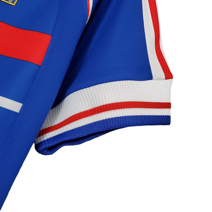 https://cdn.shopify.com/s/files/1/0826/7228/8075/files/1998-france-world-cup-home-retro-jersey-110573.webp?v=1741198761