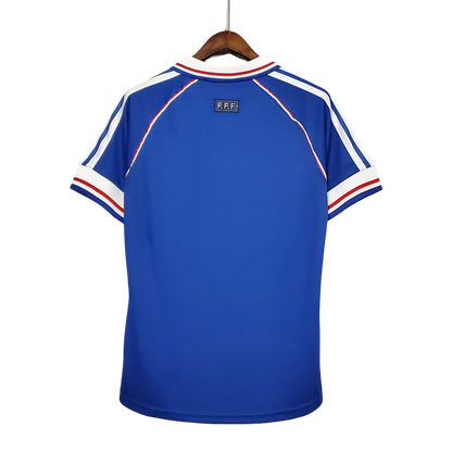 https://cdn.shopify.com/s/files/1/0826/7228/8075/files/1998-france-world-cup-home-retro-jersey-405397.webp?v=1741198761