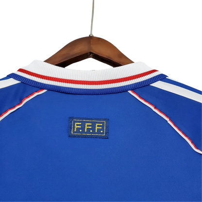https://cdn.shopify.com/s/files/1/0826/7228/8075/files/1998-france-world-cup-home-retro-jersey-608013.webp?v=1741198761