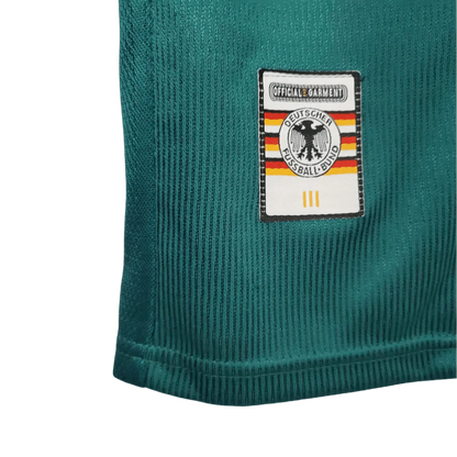 https://cdn.shopify.com/s/files/1/0826/7228/8075/files/1998-germany-away-retro-kit-165439.webp?v=1741197026