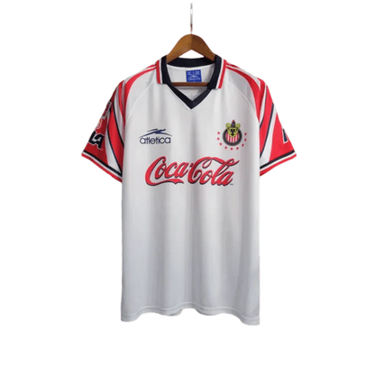 https://cdn.shopify.com/s/files/1/0826/7228/8075/files/19981998-chivas-guadalajara-cocacola-away-retro-jersey-314459.webp?v=1741197162