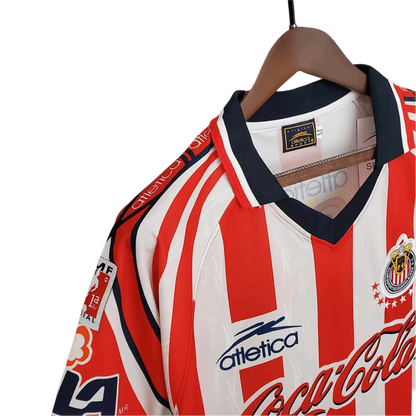 https://cdn.shopify.com/s/files/1/0826/7228/8075/files/19981999-chivas-guadalajara-coca-cola-home-retro-jersey-208994.webp?v=1741197190