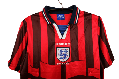 https://cdn.shopify.com/s/files/1/0826/7228/8075/files/19981999-england-away-retro-kit-classickits433-848864.webp?v=1741198459
