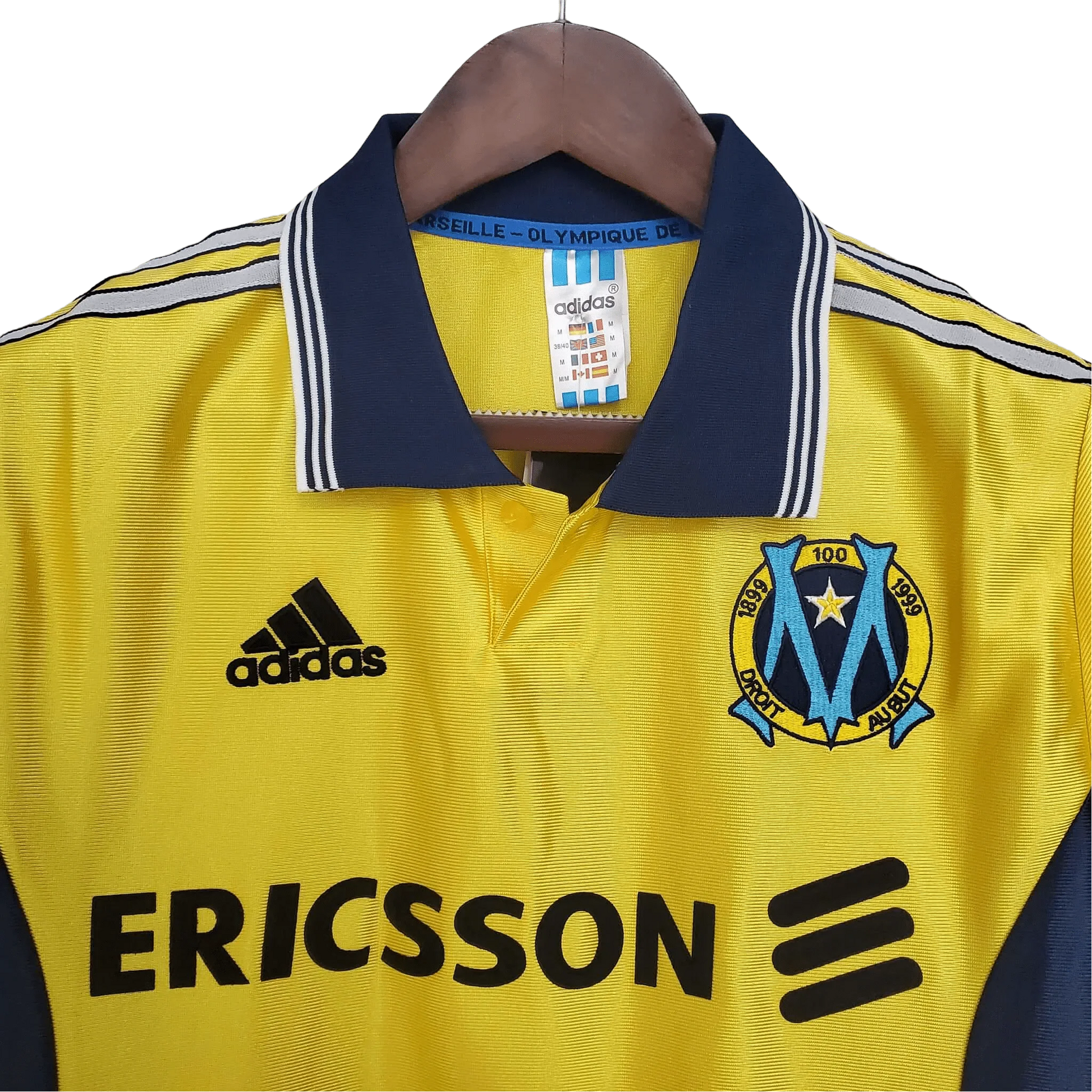 https://cdn.shopify.com/s/files/1/0826/7228/8075/files/19981999-olympique-de-marseille-ericsson-away-retro-jersey-445110.webp?v=1741199401