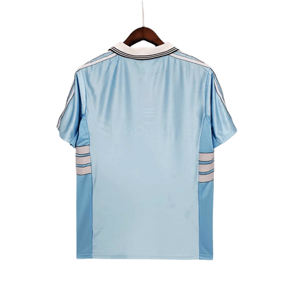 https://cdn.shopify.com/s/files/1/0826/7228/8075/files/19981999-olympique-de-marseille-ericsson-away-retro-jersey-at-govintagejersey-store-236548.webp?v=1741199391