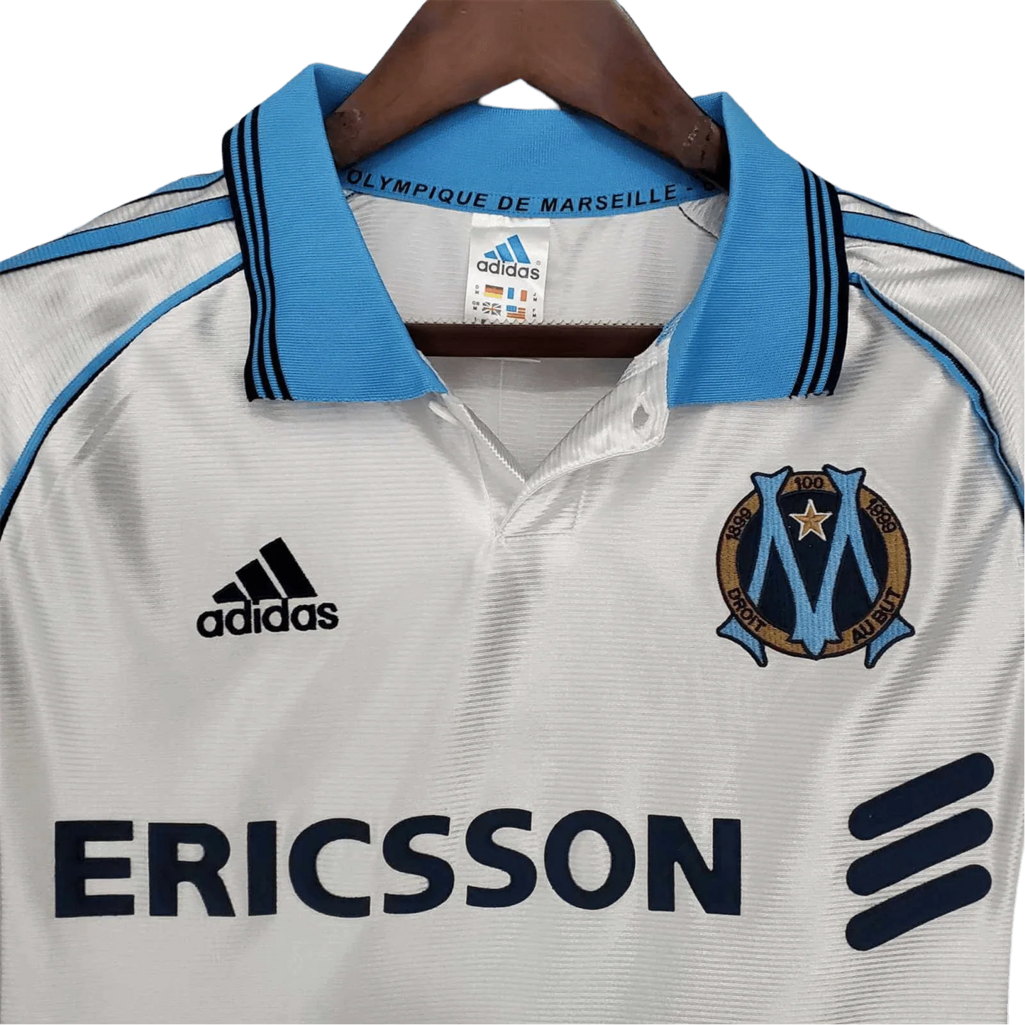 https://cdn.shopify.com/s/files/1/0826/7228/8075/files/19981999-olympique-de-marseille-ericsson-home-retro-jersey-210450.webp?v=1741199413