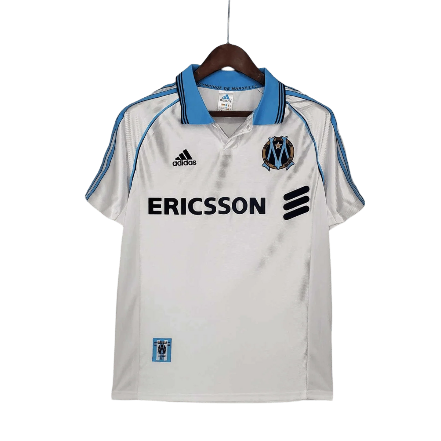 https://cdn.shopify.com/s/files/1/0826/7228/8075/files/19981999-olympique-de-marseille-ericsson-home-retro-jersey-802130.webp?v=1741199413