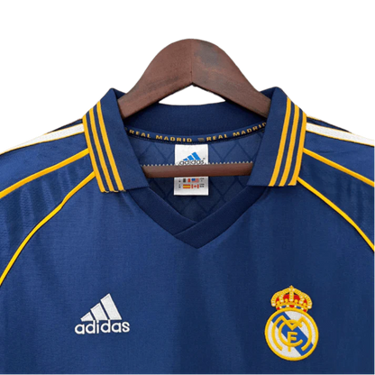 https://cdn.shopify.com/s/files/1/0826/7228/8075/files/19981999-real-madrid-teka-blue-third-retro-kit-classickits433-284420.webp?v=1741199020