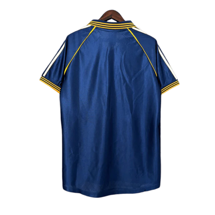 https://cdn.shopify.com/s/files/1/0826/7228/8075/files/19981999-real-madrid-teka-blue-third-retro-kit-classickits433-574045.webp?v=1741199020