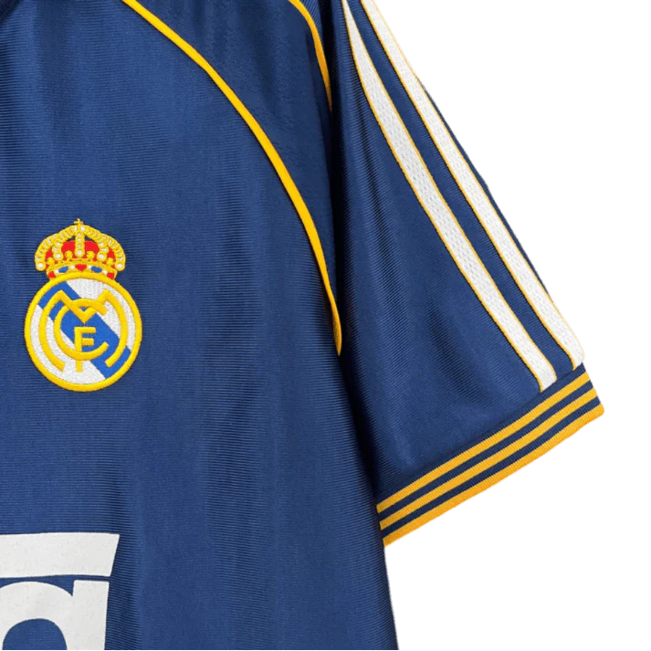 https://cdn.shopify.com/s/files/1/0826/7228/8075/files/19981999-real-madrid-teka-blue-third-retro-kit-classickits433-575040.webp?v=1741199020