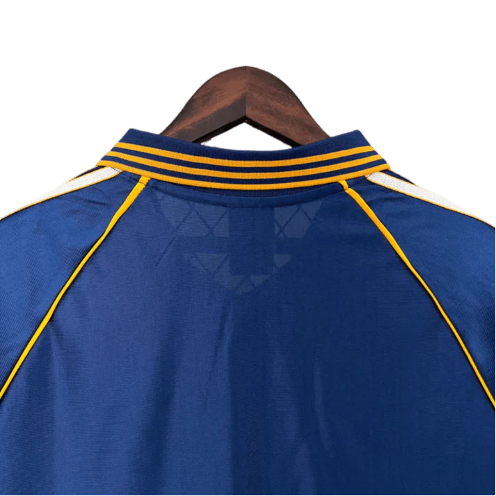 https://cdn.shopify.com/s/files/1/0826/7228/8075/files/19981999-real-madrid-teka-blue-third-retro-kit-classickits433-633068.webp?v=1741199020