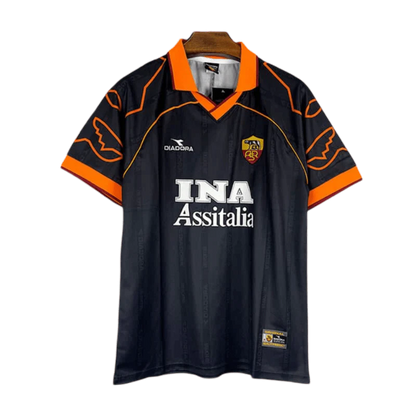 https://cdn.shopify.com/s/files/1/0826/7228/8075/files/19992000-as-roma-ina-assitalia-diadora-third-retro-kit-classickits433-731019.webp?v=1741199023