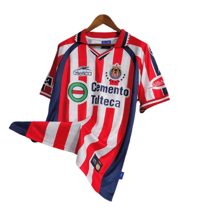 https://cdn.shopify.com/s/files/1/0826/7228/8075/files/19992000-chivas-guadalajara-cemento-tolteca-home-retro-jersey-317827.webp?v=1741197177