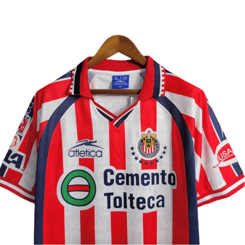 https://cdn.shopify.com/s/files/1/0826/7228/8075/files/19992000-chivas-guadalajara-cemento-tolteca-home-retro-jersey-775148.webp?v=1741197179
