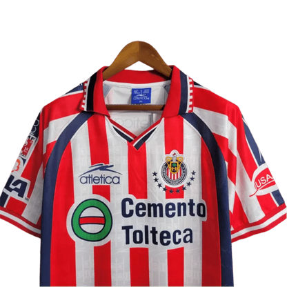 https://cdn.shopify.com/s/files/1/0826/7228/8075/files/19992000-chivas-guadalajara-cemento-tolteca-home-retro-jersey-775148.webp?v=1741197179