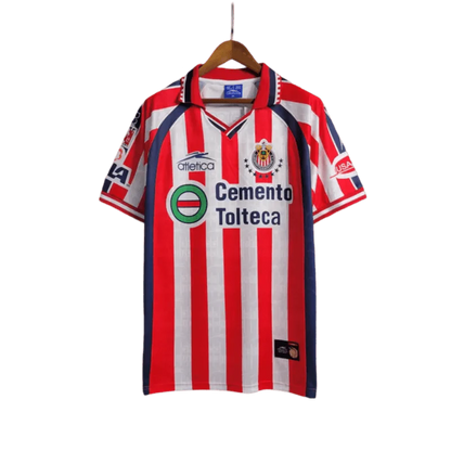 https://cdn.shopify.com/s/files/1/0826/7228/8075/files/19992000-chivas-guadalajara-cemento-tolteca-home-retro-jersey-875183.webp?v=1741197180