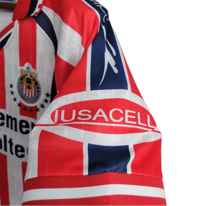 https://cdn.shopify.com/s/files/1/0826/7228/8075/files/19992000-chivas-guadalajara-cemento-tolteca-home-retro-jersey-973539.webp?v=1741197182