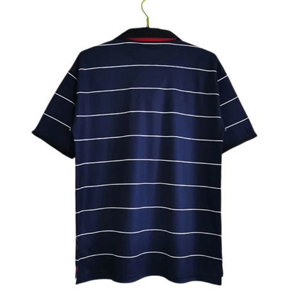 https://cdn.shopify.com/s/files/1/0826/7228/8075/files/19992000-manchester-united-sharp-digital-blue-away-retro-kit-classickits433-600855.webp?v=1741199145
