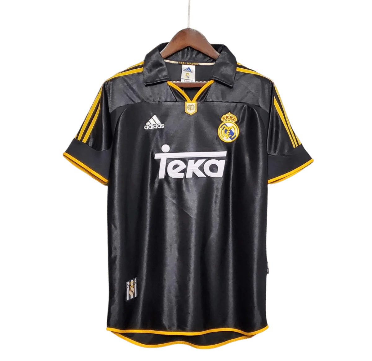 https://cdn.shopify.com/s/files/1/0826/7228/8075/files/19992000-real-madrid-teka-black-away-retro-kit-classickits433-692173.webp?v=1741199019