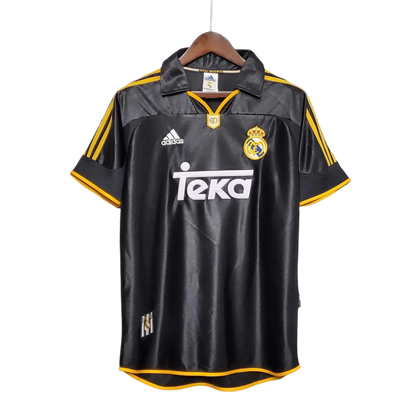 https://cdn.shopify.com/s/files/1/0826/7228/8075/files/19992000-real-madrid-teka-black-away-retro-kit-classickits433-692173.webp?v=1741199019