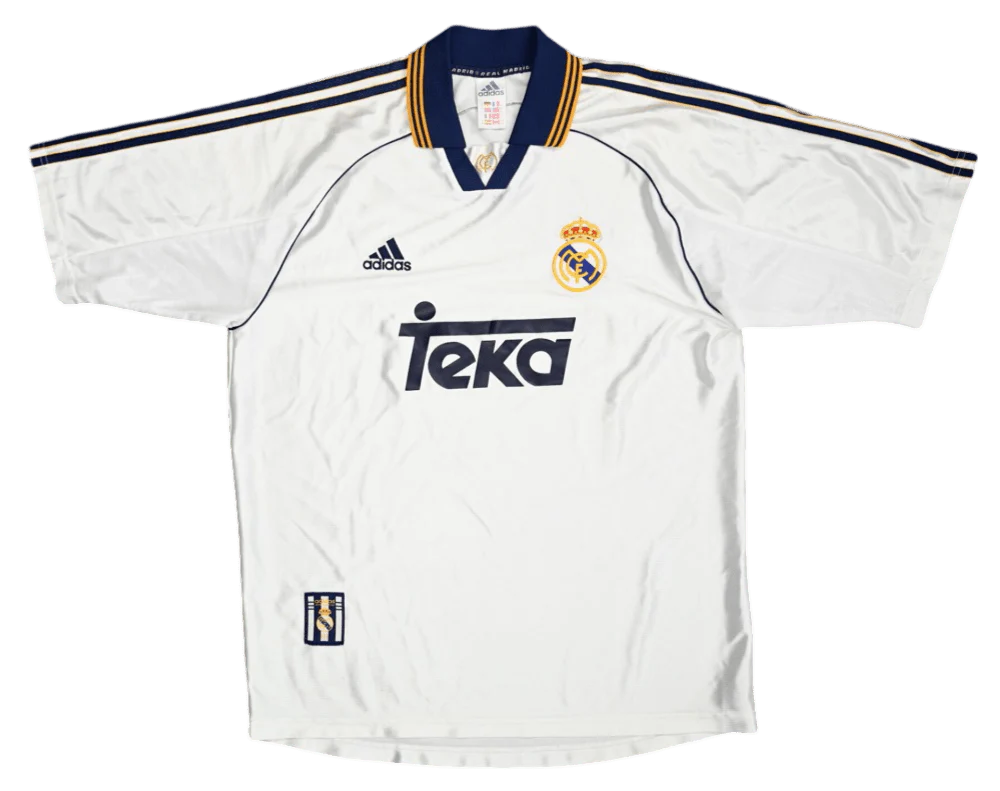 https://cdn.shopify.com/s/files/1/0826/7228/8075/files/19992000-real-madrid-teka-white-home-retro-kit-classickits433-354639.webp?v=1741199042