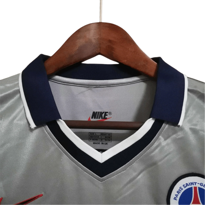 https://cdn.shopify.com/s/files/1/0826/7228/8075/files/2000-2001-paris-saint-germain-opel-grey-away-retro-kit-217965.webp?v=1741199394
