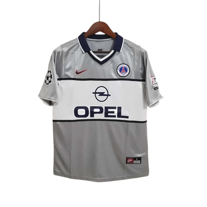 https://cdn.shopify.com/s/files/1/0826/7228/8075/files/2000-2001-paris-saint-germain-opel-grey-away-retro-kit-533154.webp?v=1741199392