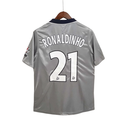 https://cdn.shopify.com/s/files/1/0826/7228/8075/files/2000-2001-paris-saint-germain-opel-grey-away-retro-kit-552187.webp?v=1741199394