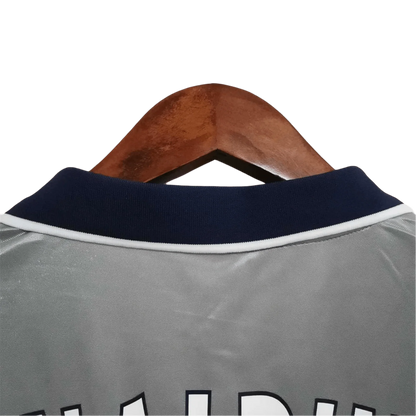 https://cdn.shopify.com/s/files/1/0826/7228/8075/files/2000-2001-paris-saint-germain-opel-grey-away-retro-kit-769387.webp?v=1741199394