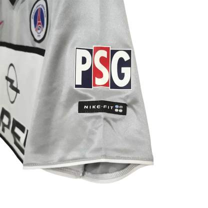 https://cdn.shopify.com/s/files/1/0826/7228/8075/files/2000-2001-paris-saint-germain-opel-grey-away-retro-kit-841031.webp?v=1741199394