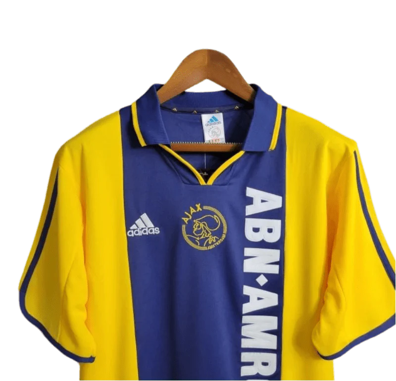 https://cdn.shopify.com/s/files/1/0826/7228/8075/files/20002001-ajax-abn-amro-away-retro-kit-classickits433-622387.webp?v=1741199339