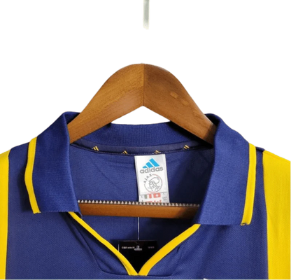 https://cdn.shopify.com/s/files/1/0826/7228/8075/files/20002001-ajax-abn-amro-away-retro-kit-classickits433-964542.webp?v=1741199338