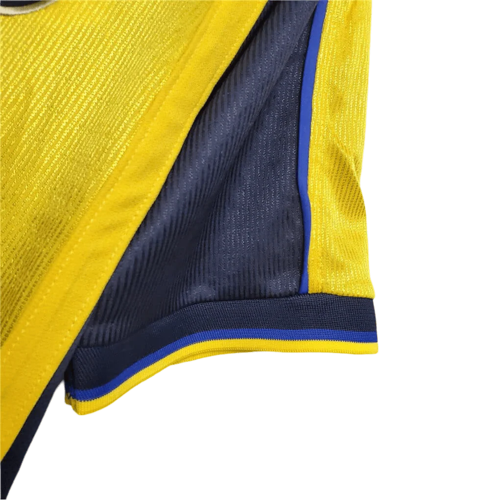 https://cdn.shopify.com/s/files/1/0826/7228/8075/files/20002001-arsenal-sega-yellow-away-retro-kit-classickits433-104176.webp?v=1741199337