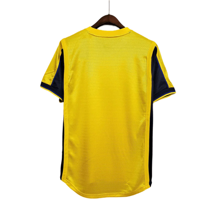 https://cdn.shopify.com/s/files/1/0826/7228/8075/files/20002001-arsenal-sega-yellow-away-retro-kit-classickits433-624195.webp?v=1741199342