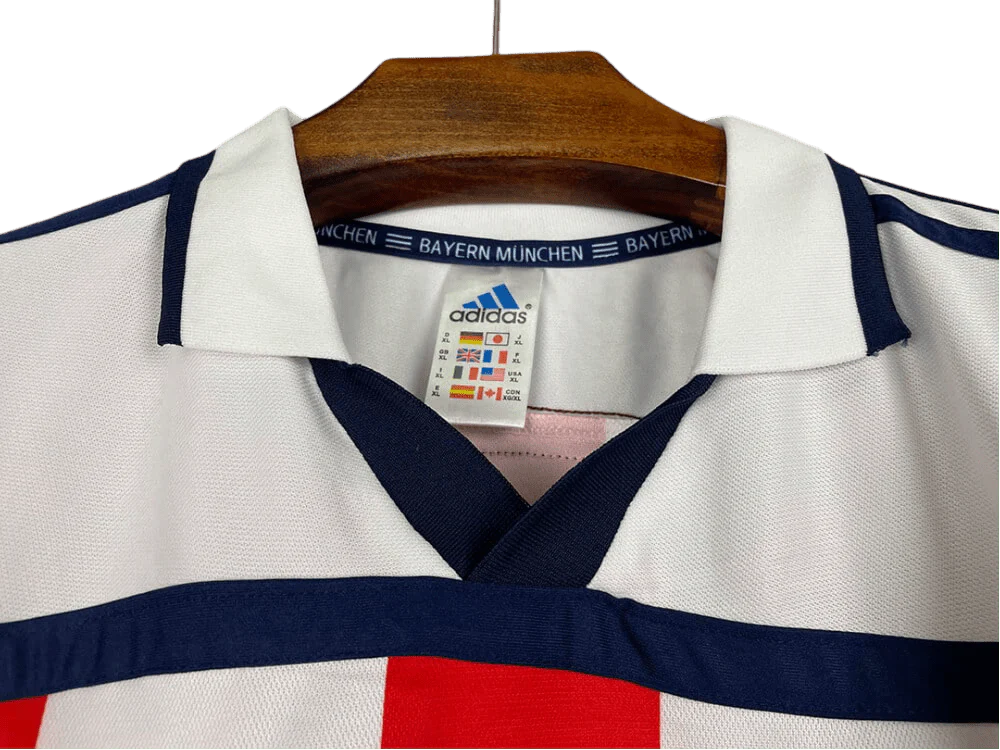 https://cdn.shopify.com/s/files/1/0826/7228/8075/files/20002001-bayern-munich-opel-away-white-retro-kit-classickits433-728293.webp?v=1741199347