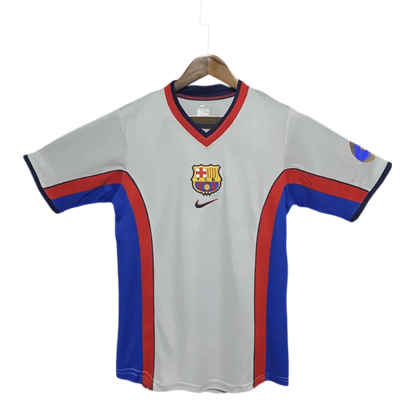 https://cdn.shopify.com/s/files/1/0826/7228/8075/files/20002001-fc-barcelona-away-retro-kit-classickits433-583332.webp?v=1741197542
