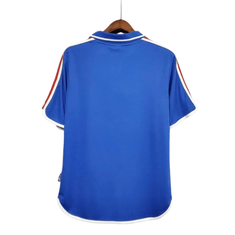 https://cdn.shopify.com/s/files/1/0826/7228/8075/files/20002001-france-home-retro-jersey-262261.webp?v=1741198520