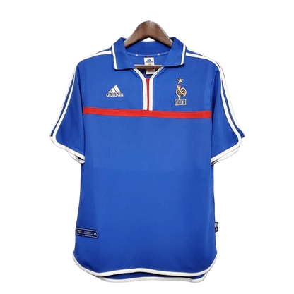 https://cdn.shopify.com/s/files/1/0826/7228/8075/files/20002001-france-home-retro-jersey-473401.webp?v=1741198520