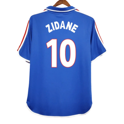 https://cdn.shopify.com/s/files/1/0826/7228/8075/files/20002001-france-home-retro-jersey-631957.webp?v=1741198518