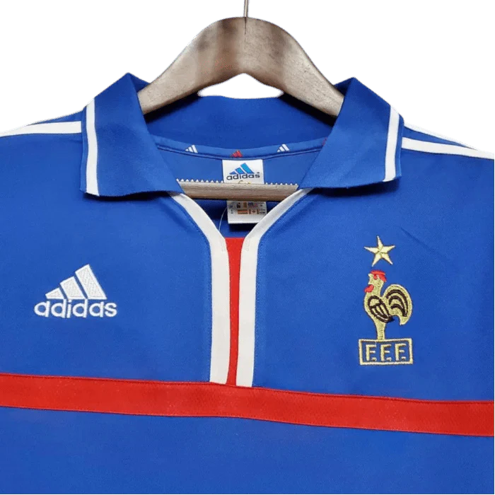https://cdn.shopify.com/s/files/1/0826/7228/8075/files/20002001-france-home-retro-jersey-779401.webp?v=1741198520