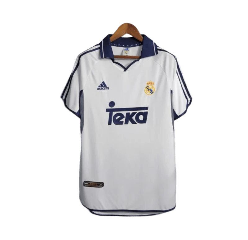https://cdn.shopify.com/s/files/1/0826/7228/8075/files/20002001-real-madrid-teka-white-home-retro-kit-classickits433-538901.webp?v=1741199026
