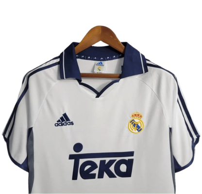 https://cdn.shopify.com/s/files/1/0826/7228/8075/files/20002001-real-madrid-teka-white-home-retro-kit-classickits433-639598.webp?v=1741199025