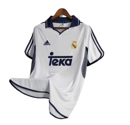 https://cdn.shopify.com/s/files/1/0826/7228/8075/files/20002001-real-madrid-teka-white-home-retro-kit-classickits433-869720.webp?v=1741199026