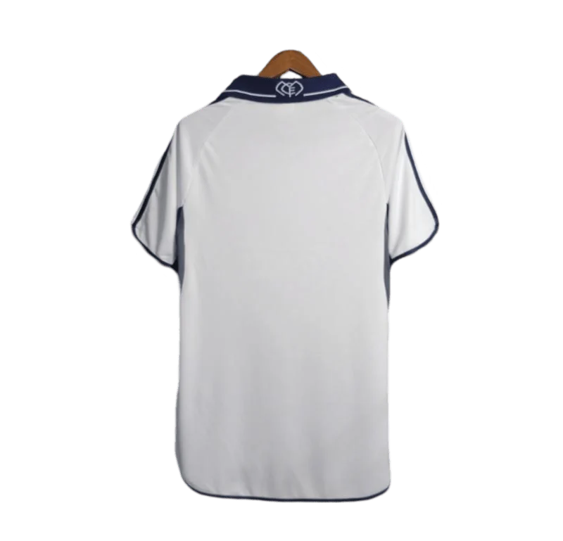 https://cdn.shopify.com/s/files/1/0826/7228/8075/files/20002001-real-madrid-teka-white-home-retro-kit-classickits433-876619.webp?v=1741199027