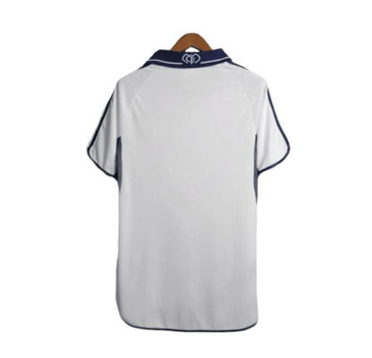 https://cdn.shopify.com/s/files/1/0826/7228/8075/files/20002001-real-madrid-teka-white-home-retro-kit-classickits433-876619.webp?v=1741199027
