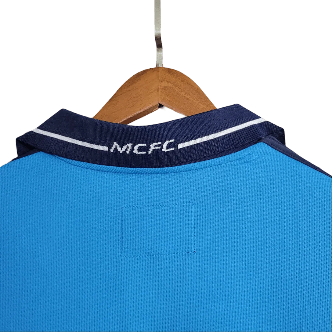 https://cdn.shopify.com/s/files/1/0826/7228/8075/files/20012002-manchester-city-eidos-home-retro-kit-classickits433-539241.webp?v=1741198009