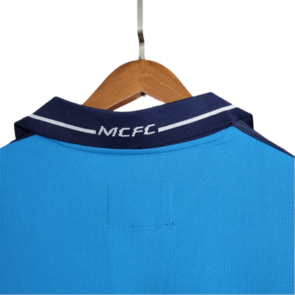 https://cdn.shopify.com/s/files/1/0826/7228/8075/files/20012002-manchester-city-eidos-home-retro-kit-classickits433-539241.webp?v=1741198009