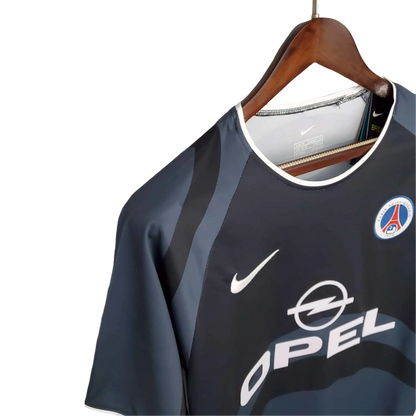https://cdn.shopify.com/s/files/1/0826/7228/8075/files/20012002-paris-saint-germain-opel-3rd-black-retro-kit-768025.webp?v=1741198006