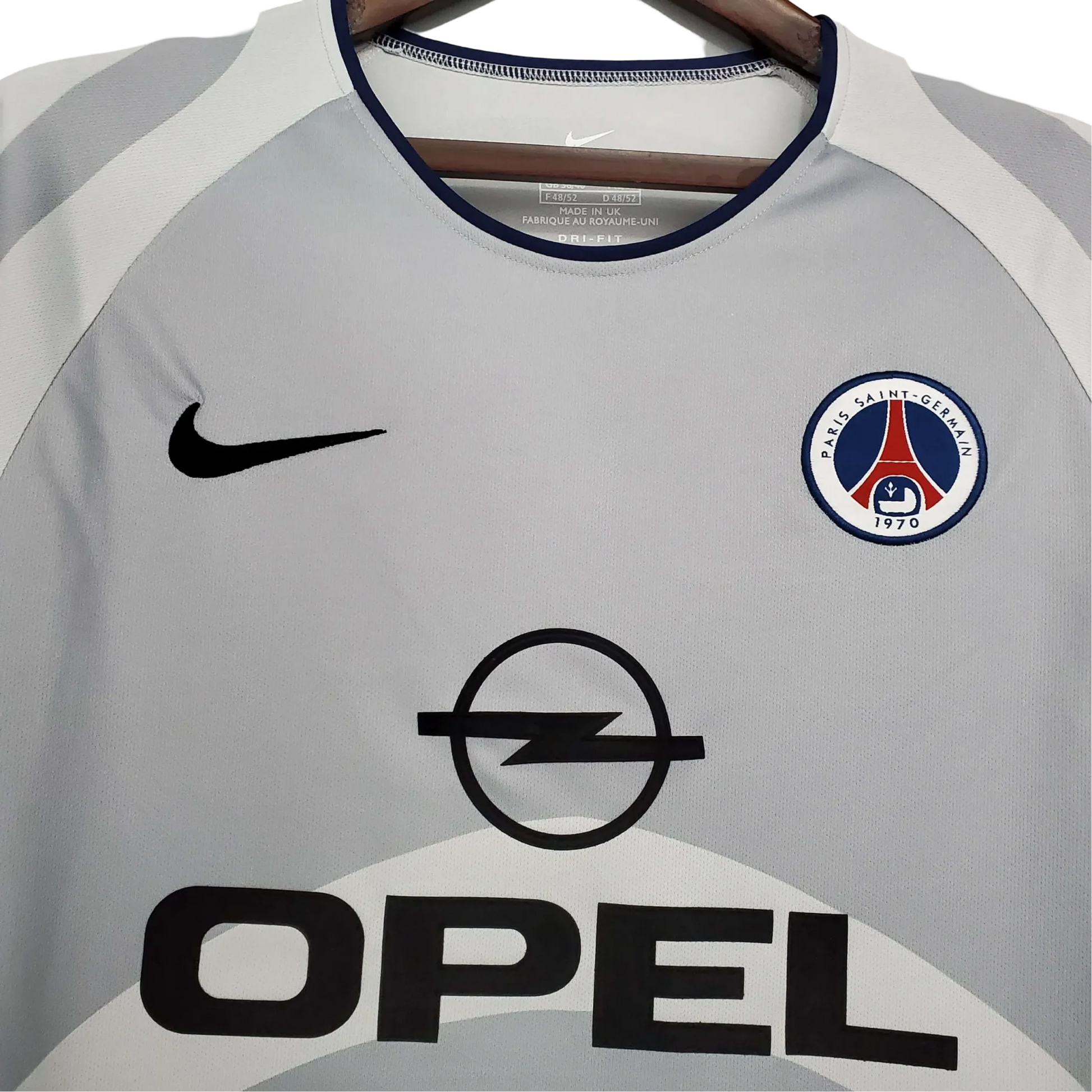 https://cdn.shopify.com/s/files/1/0826/7228/8075/files/20012002-paris-saint-germain-opel-away-grey-retro-jersey-297796.webp?v=1741198005